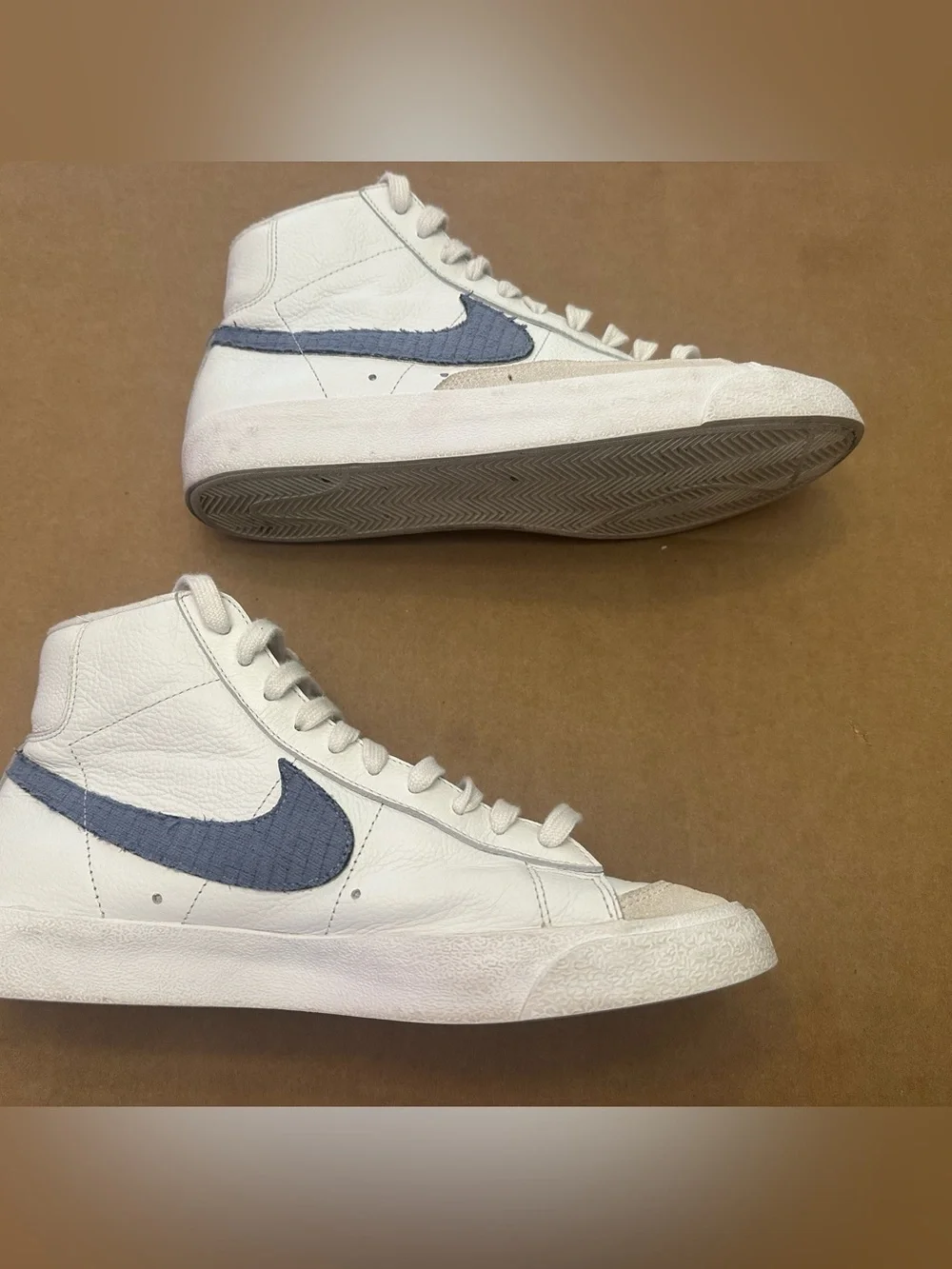 Nike White High-Top Sneakers with Blue Swoosh